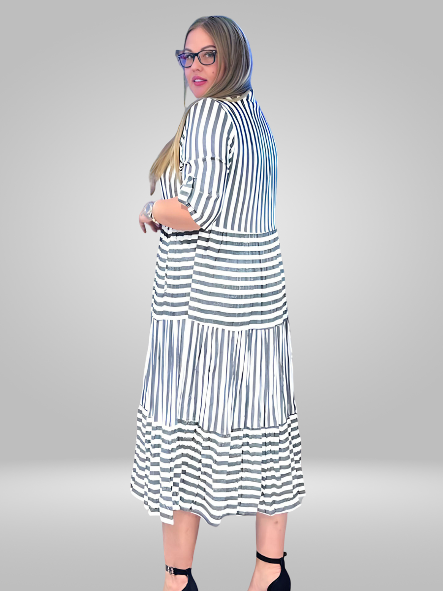 Make a statement with the Ay-Sel Dress, crafted from 100% cotton. This dress boasts a high waist and unique print, making it a standout piece. With a perfect balance of comfort and style, this timeless dress is a must-have for any wardrobe.