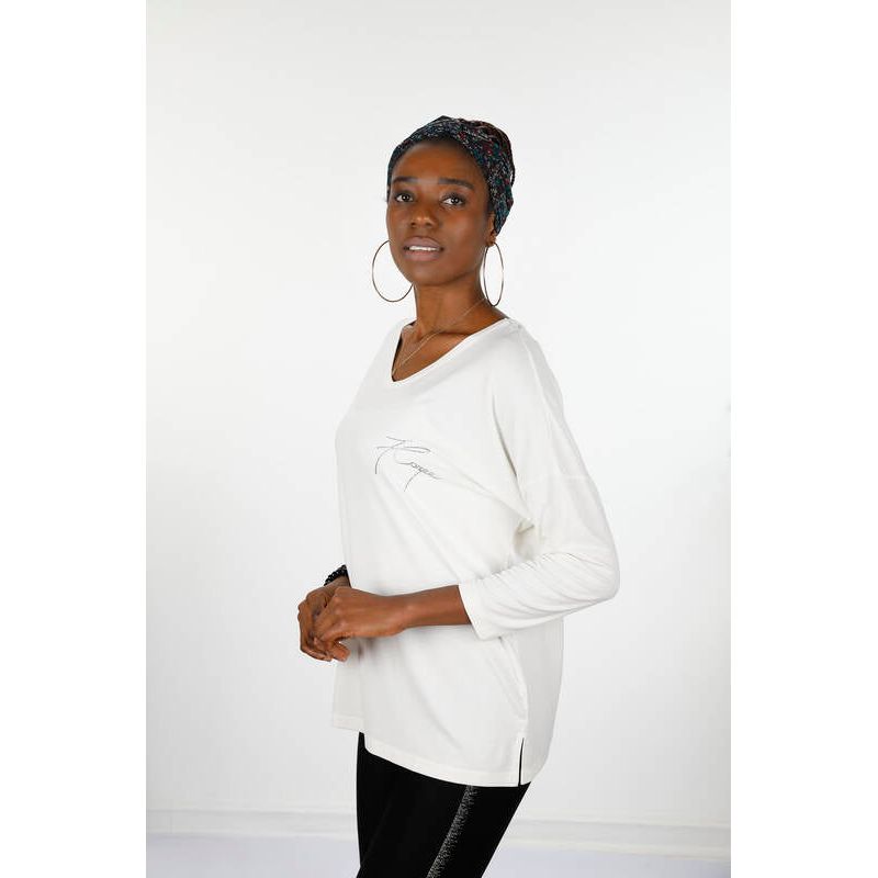Introducing the Kazee Blouse - a stylish and comfortable addition to your wardrobe. This women's blouse features a crew neck and long sleeves, with letter detailing for a unique touch. Made from 95% viscose and 5% elastane for a soft and stretchy fit. Perfect for any occasion, this blouse is a must-have for any fashion-forward woman. Shop now and elevate your style game!
