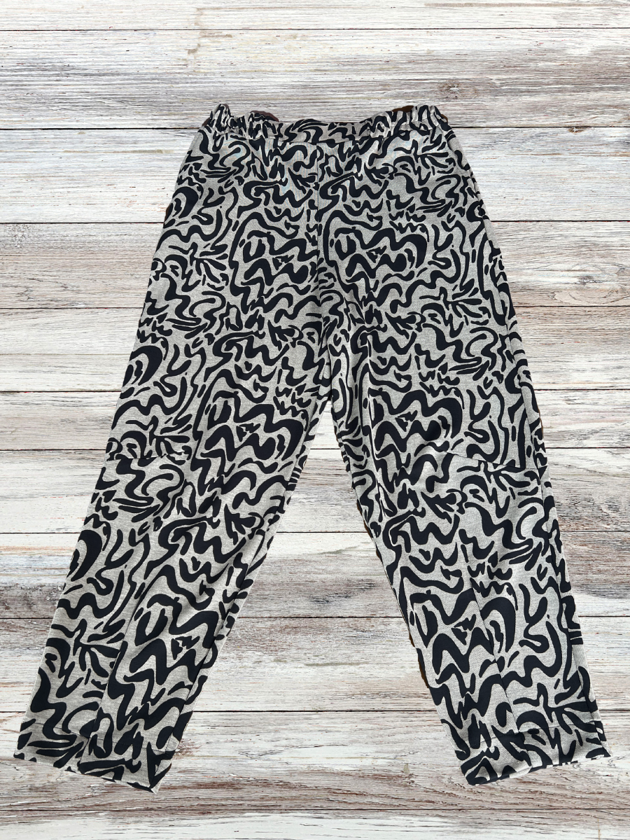 Darkwin Abstract Print Plus Size Pants in sizes 18-20, showcasing the distinctive design and fabric blend for a detailed view of their quality and fashion-forward appeal.
