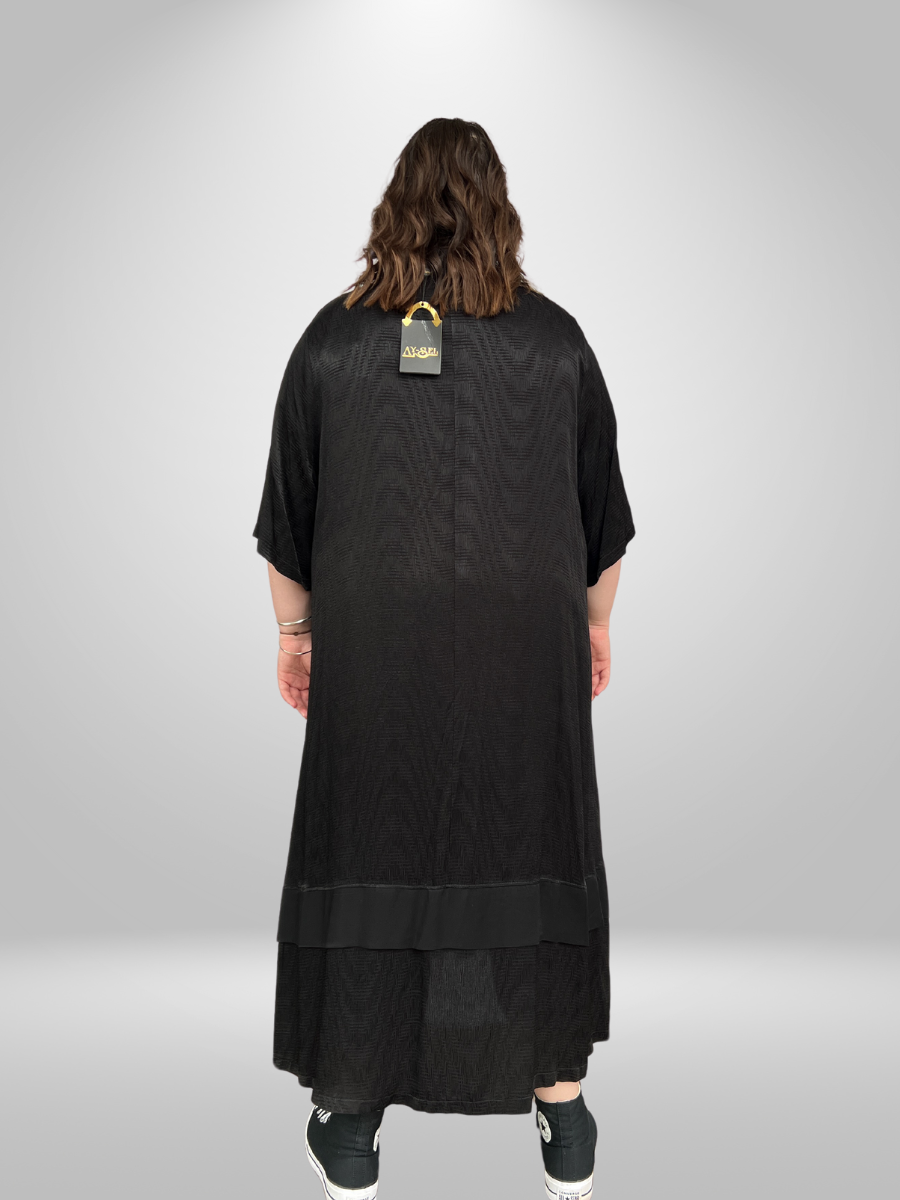 A curvy woman wearing the Cascading Layered Plus Size Maxi Dress with Collared Neckline, showcasing the trendy curvy fashion maxi dress in New Zealand