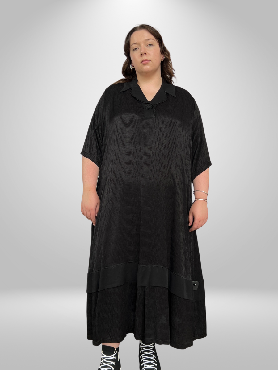 A curvy woman wearing the Cascading Layered Plus Size Maxi Dress with Collared Neckline, showcasing the trendy curvy fashion maxi dress in New Zealand