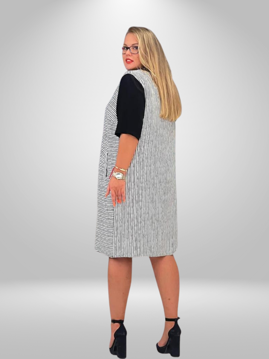 A curvy woman wearing the Ay-Sel Striped Midi Plus Size Dress with Contrast Sleeves, showcasing the trendy curvy fashion dress in New Zealand.