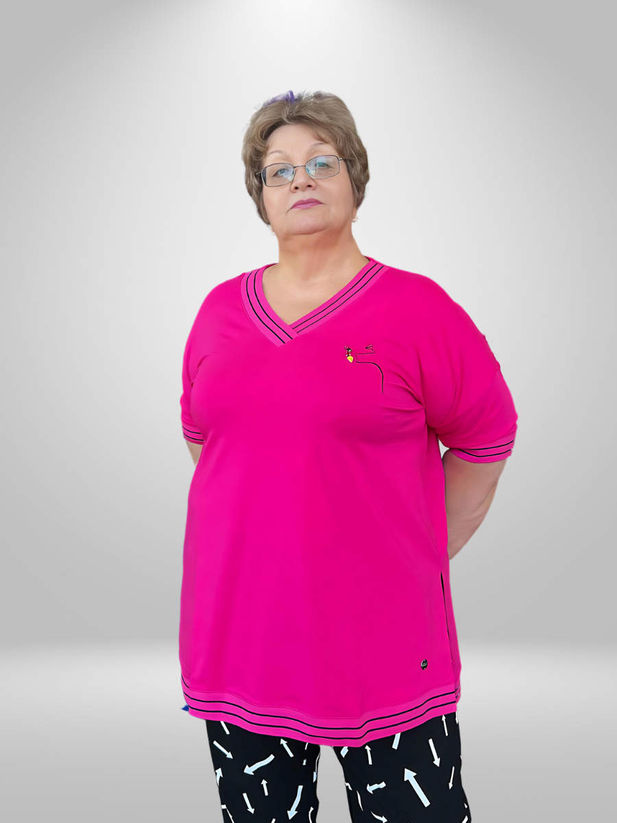 A curvy woman wearing the Munna Morning Dew Plus Size T-Shirt, showcasing the trendy curvy fashion t-shirt in New Zealand.