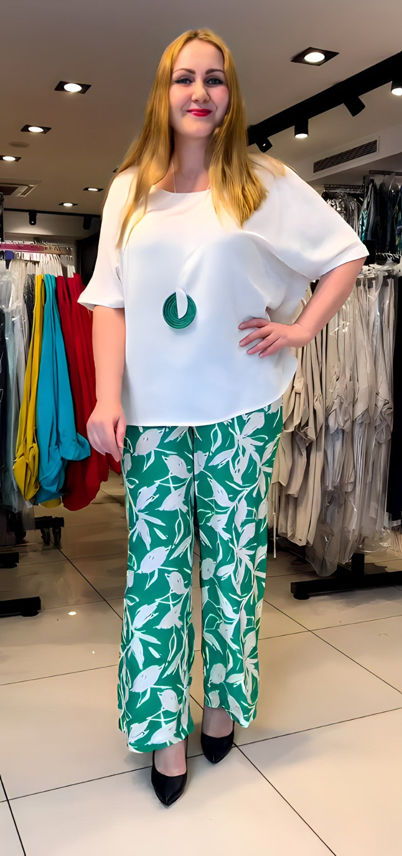 Upgrade your office wardrobe with the BISA Blouse and Pants Set. This set includes a silky smooth blouse, stylish pants, and an amulet trinket for added flair. The lightweight design makes it perfect for everyday wear, while the classic design ensures a timeless look. Elevate your style and feel confident in this versatile and chic set.