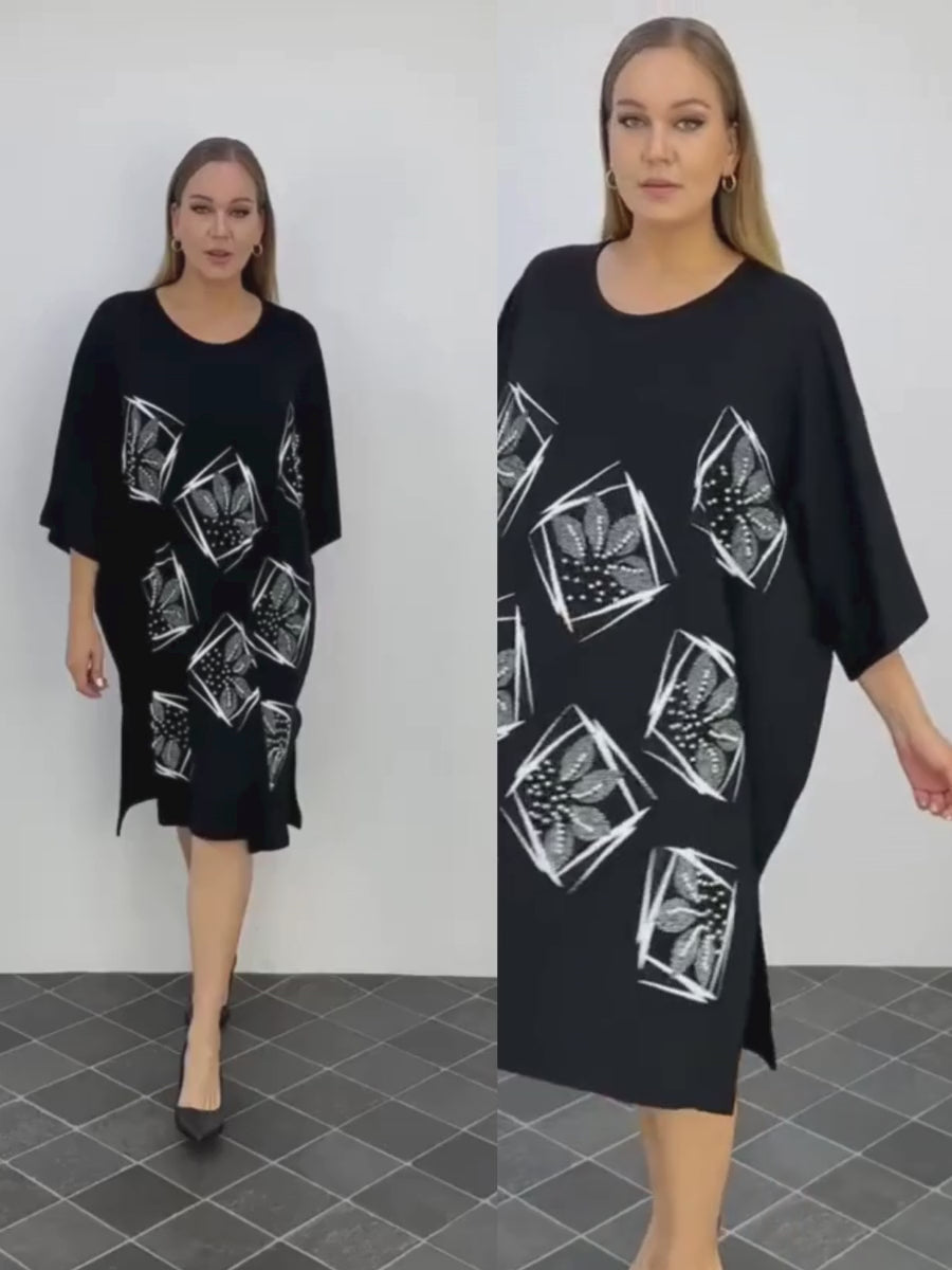 Video walkthrough of the Plus Size Darkwin Midi Dress, highlighting the embellished neckline and elegant midi length, made from breathable viscose fabric, in sizes 22-24 for New Zealand's plus-size fashion enthusiasts.
