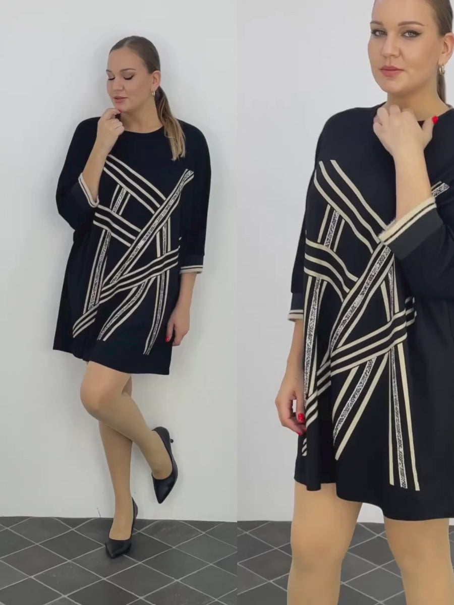 A video featuring a curvy model confidently strutting in the Darkwin GeoGlam Shift Plus Size Tunic Dress, highlighting its flattering fit and stylish design for curvy women in New Zealand.
