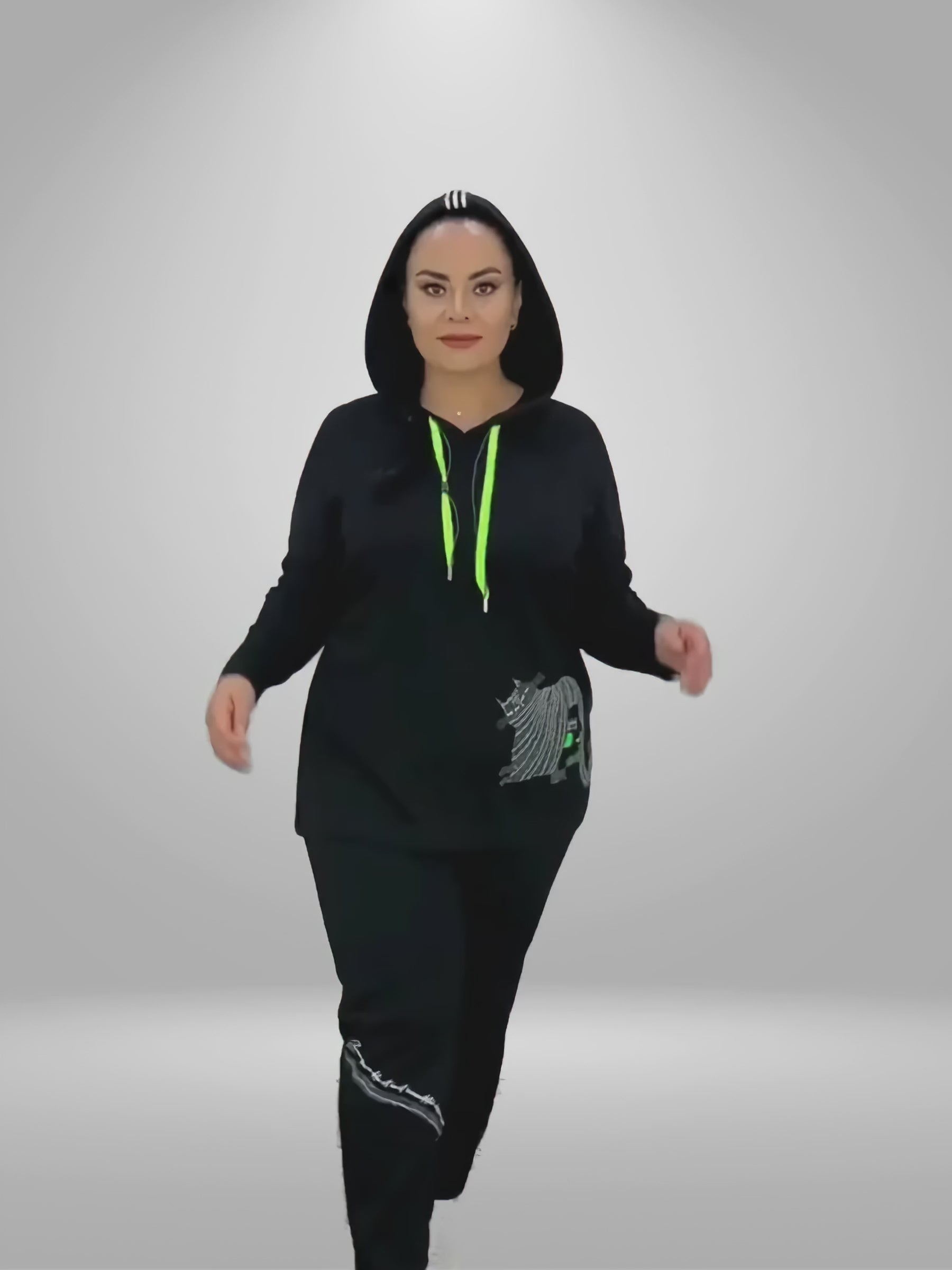 Video demonstration of the Darkwin Cheshire Cat Women's Hoodie & Pants Set. The video highlights a model wearing the set in sizes 16-20, emphasizing the softness of the viscose-polyester blend and the unique Cheshire Cat design.