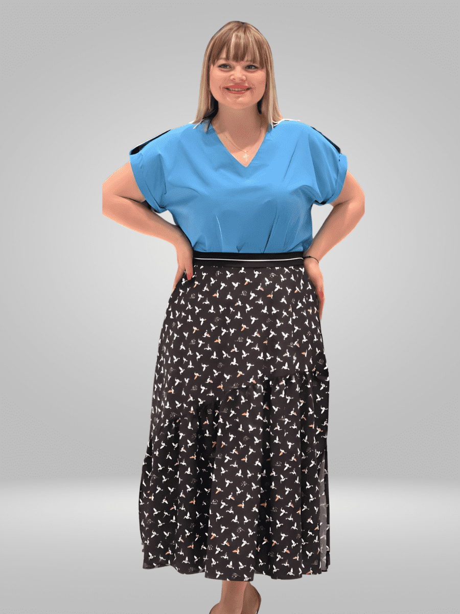 Introducing the Pienna Skirt (12-18), a sophisticated and versatile piece featuring a high-waisted silhouette. Made from a lightweight and comfortable fabric, this skirt can be dressed up or down for any event. Elevate your wardrobe with this timeless and chic addition.