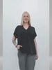 A close-up and full-body video showcasing the black polka dot blouse for plus-size women, emphasizing its lightweight and breathable fabric ideal for summer.
