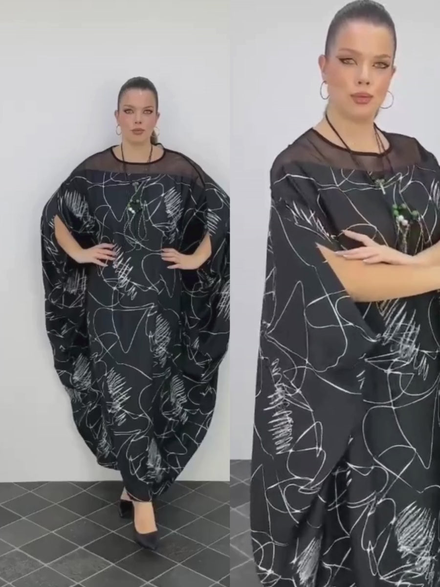 A video featuring a curvy model gracefully walking in the Darkwin Stylish Cursive Plus Size Dress, highlighting its elegant design and flattering fit for plus size women in New Zealand.