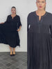 Video walkthrough of the Plus Size Darkwin Midi Dress, highlighting the embellished neckline and elegant midi length, made from breathable viscose fabric, in sizes 22-24 for New Zealand's plus-size fashion enthusiasts.